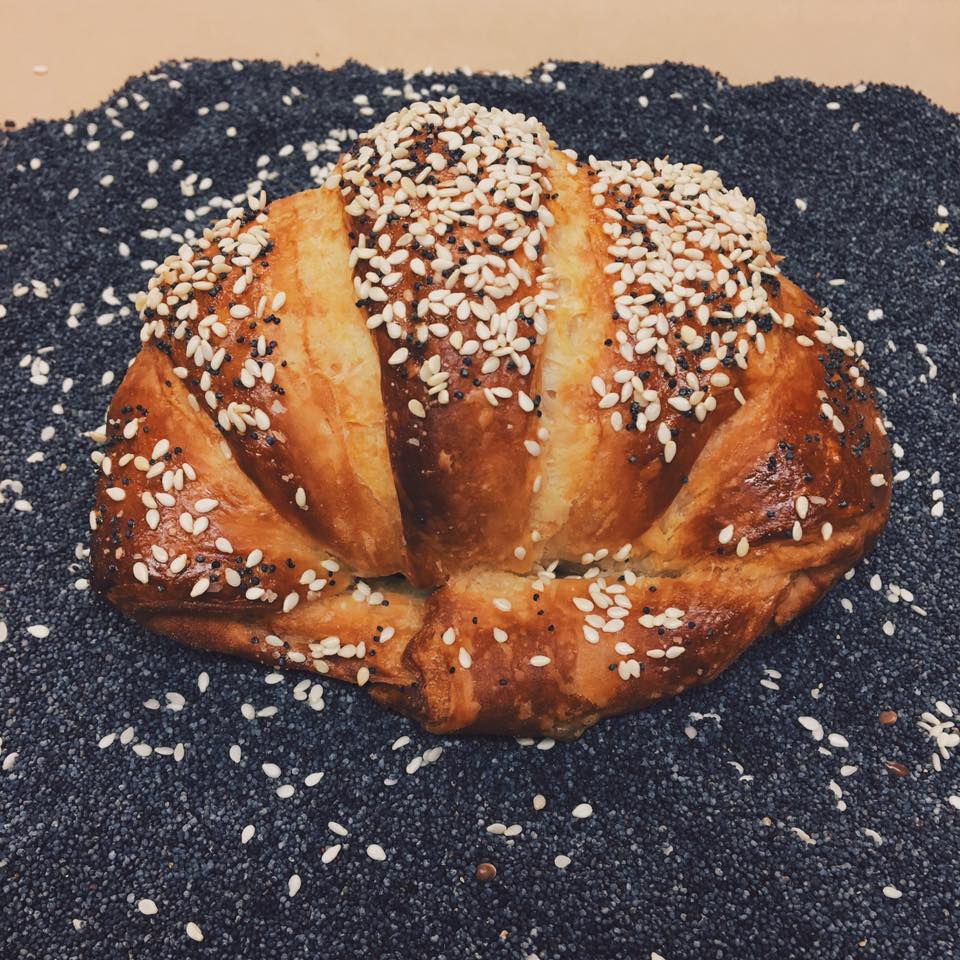 Seeded croissant on poppy seeds